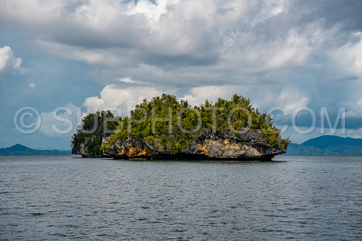 Waigeo- Kri- Mushroom Island- group of small islands in shallow blue lagoon water- Raja Ampat- West Papua- Indonesia